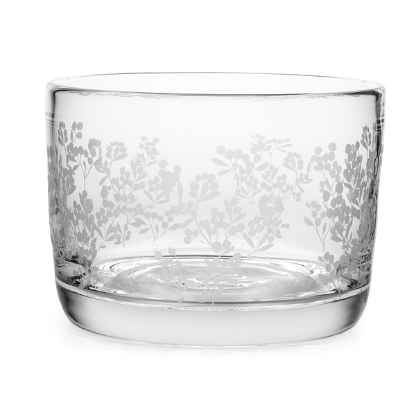 The Simon Pearce Berry Bowl features clear, lead-free glass with etched floral patterns reminiscent of a delicate block print, ideal as a stunning centerpiece or for serving your favorite beverages.