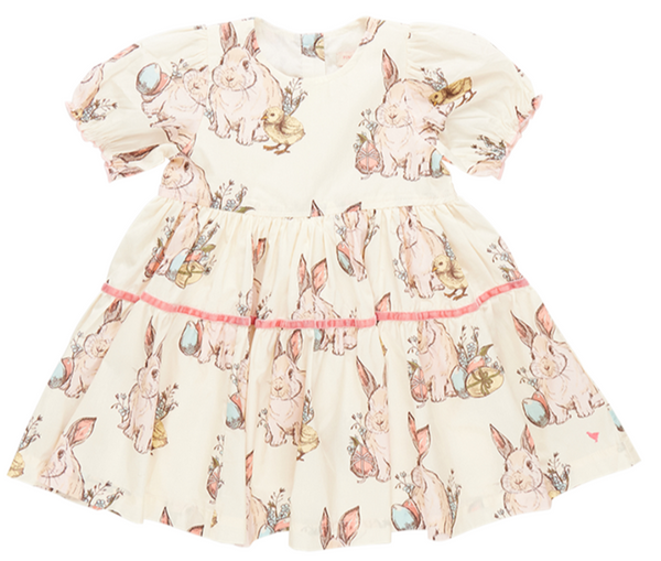 A vintage Pink Chicken Girl's Maribelle, Bunny Friends dress adorned with rabbits, evoking nostalgic memories.