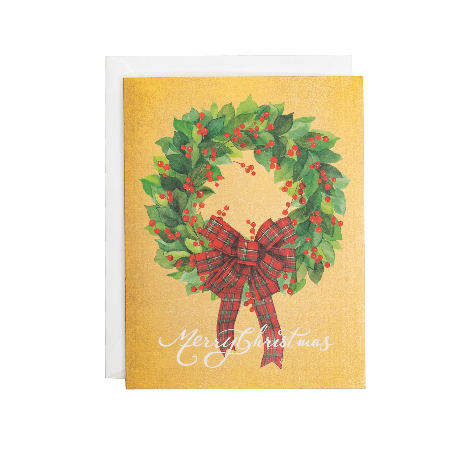 Caspari's Leaf Wreath with Plaid Bow Boxed Card Set features a festive wreath with red berries and a plaid bow, "Merry Christmas" below on a gold background. An envelope is partially visible behind the card.