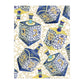 Add a festive touch to your Hanukkah celebration or holiday gifts with the Caspari Patterned Dreidel Collection, featuring blue and gold dreidels adorned with Hebrew letters and arranged diagonally on a white background enhanced by an elegant gold decorative design.