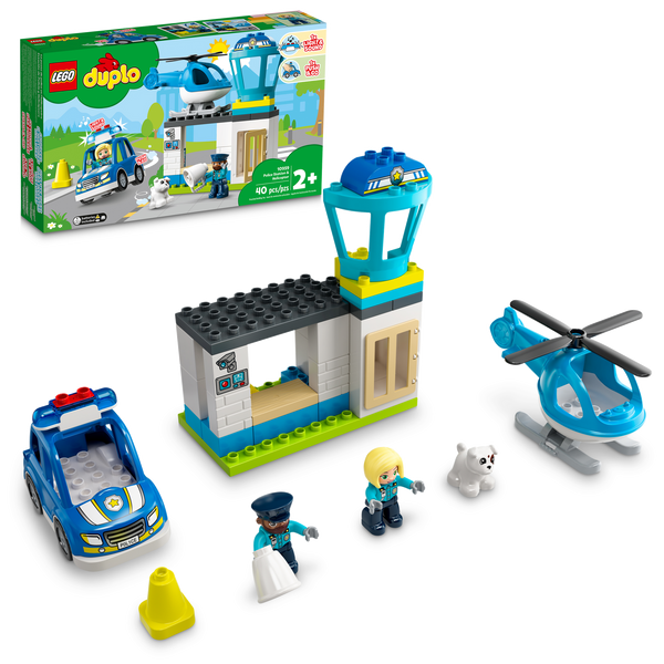 An image of a Legos - Toyhouse LEGO® DUPLO® Police Station & Helicopter playset, featuring a building, a police car, a police helicopter, three figurines, a small cat figure, and a traffic cone, alongside the