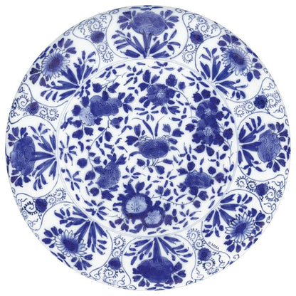 Round porcelain plate with blue floral and bird motifs pairs perfectly with Caspari’s Delft Blue Napkin Collection for an elegant, sustainable table setting.