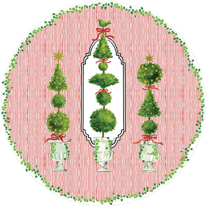 The Eloise Napkin and Placemat Collection by Caspari features a round design with three green topiary arrangements in white urns, red bows, and a green leafy border. These triple-ply napkins are chlorine-free and printed in Germany.