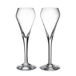 The Vintner Flute Gift Set by Simon Pearce features two clear, modern champagne flutes with elongated stems, displayed side by side on a white background—ideal for serving sparkling wine.