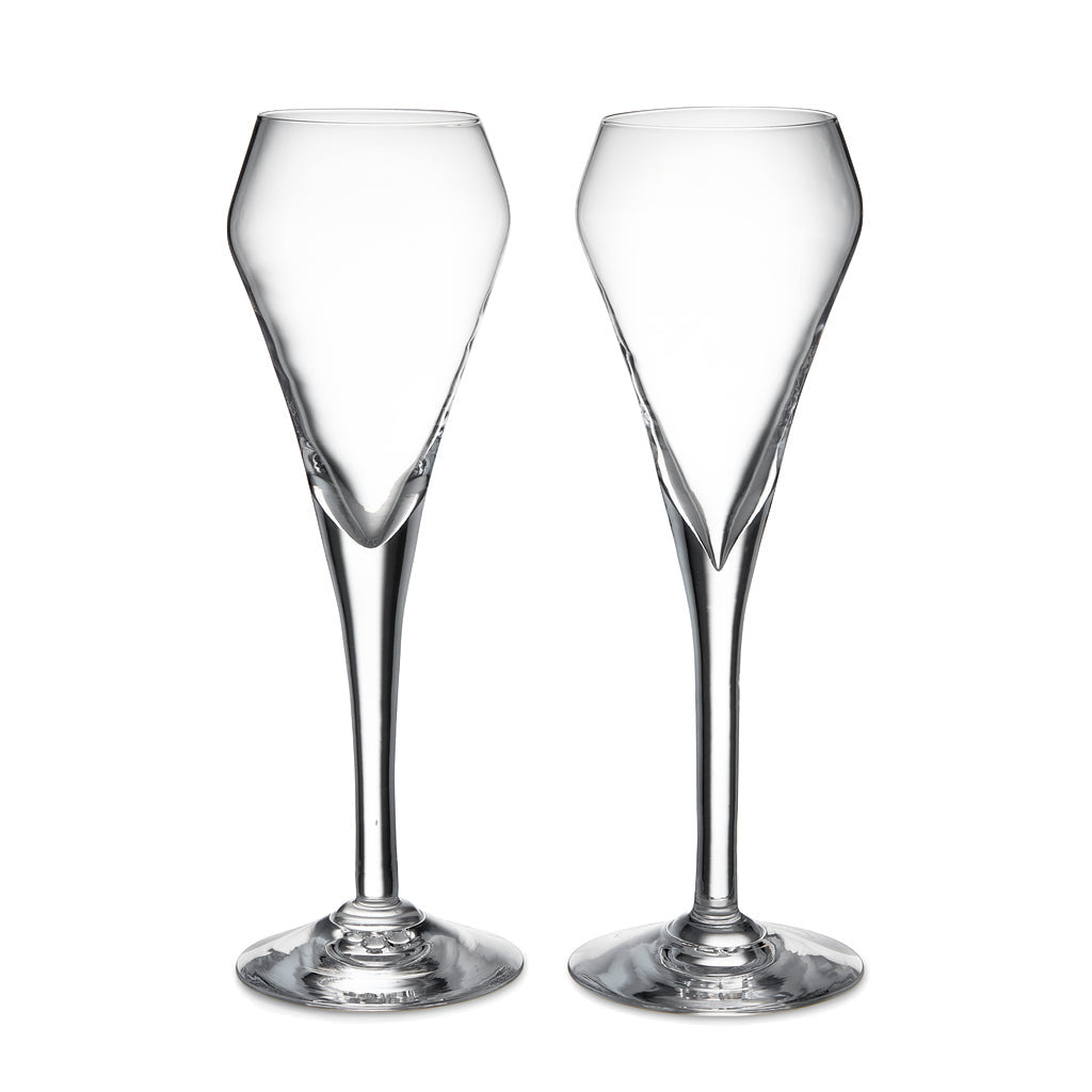 The Vintner Flute Gift Set by Simon Pearce features two clear, modern champagne flutes with elongated stems, displayed side by side on a white background—ideal for serving sparkling wine.