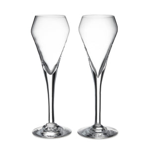 The Vintner Flute Gift Set by Simon Pearce features two clear, modern champagne flutes with elongated stems, displayed side by side on a white background—ideal for serving sparkling wine.