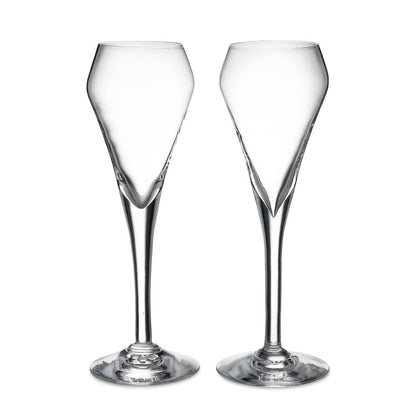 The Vintner Flute Gift Set by Simon Pearce features two clear, modern champagne flutes with elongated stems, displayed side by side on a white background—ideal for serving sparkling wine.