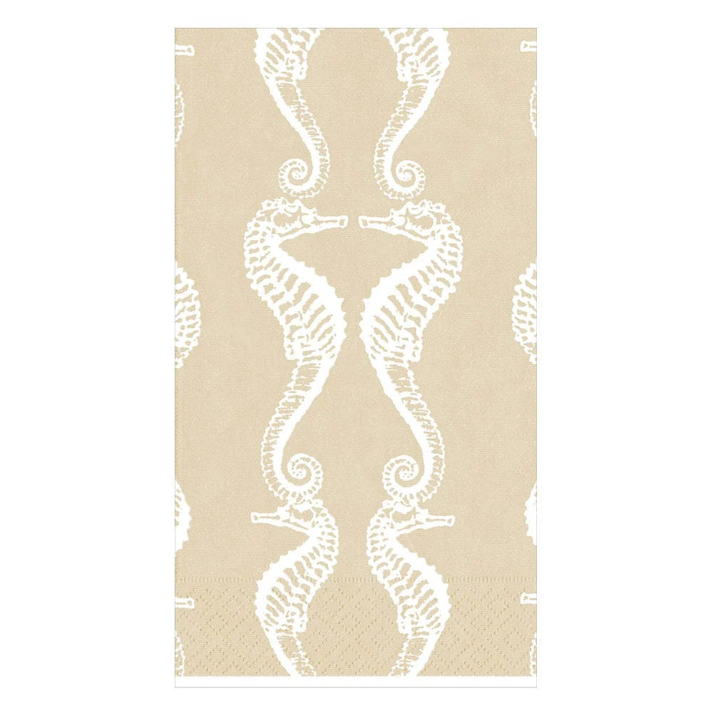 The Caspari Seahorses Collection features beige triple-ply napkins with a white repeating seahorse design, pairs facing each other vertically. Eco-friendly and stylish, they bring charm to any table setting.