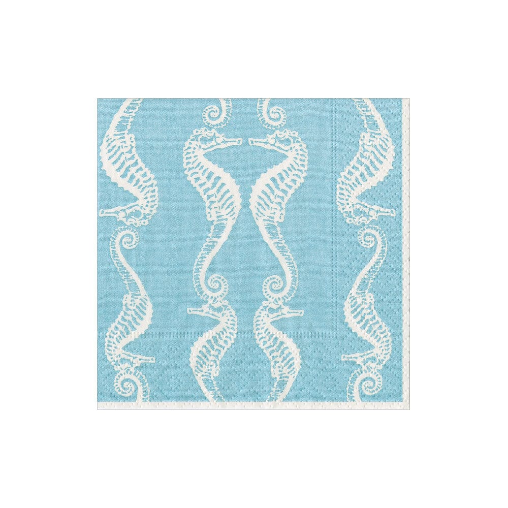 Caspari’s Seahorses Collection features blue, eco-friendly napkins with a repeating white seahorse pattern. Biodegradable and stylish, they add coastal charm to any table setting.