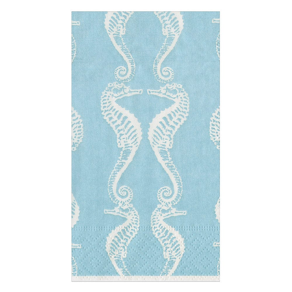 From Caspari's Seahorses Collection, this light blue triple-ply napkin features pairs of white seahorses facing each other in a vertical repeating pattern.