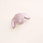 The Foggy Dog Easter Bunny 2-in-1 Bounce Dog Toy, featuring closed eyes and two floppy ears, rests on a plain light background.