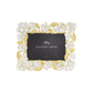 A rectangular picture frame from the Gardenia Collection by Michael Aram, featuring gold and white floral accents with gold forged leaves and a "Michael Aram" placeholder card.