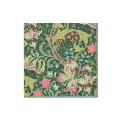 The Golden Lily Collection by Caspari features a green square fabric with ornate floral patterns in cream, pink, and yellow—ideal as eco-friendly napkins for stylish, sustainable table settings.