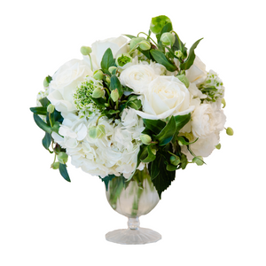 An arrangement of Hive Classic white flowers in a glass vase: The Live Classic Floral Arrangement by Hive Floral Studio, displayed in an April Vase.