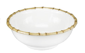 The Juliska Classic Bamboo Medium Serving Bowl features a white ceramic design with a gold bamboo rim, making it perfect for adding modern style to your table setting.