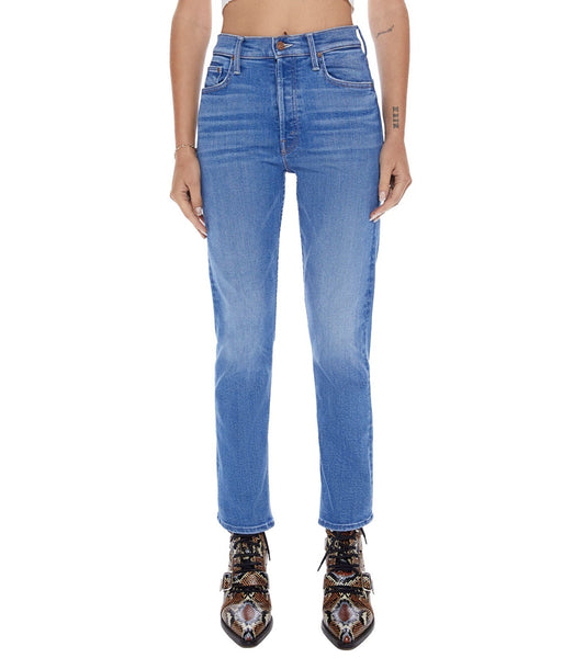 A woman wearing a pair of Mother Denim The Tomcat high-rise straight leg jeans with a cropped inseam and a crop top.