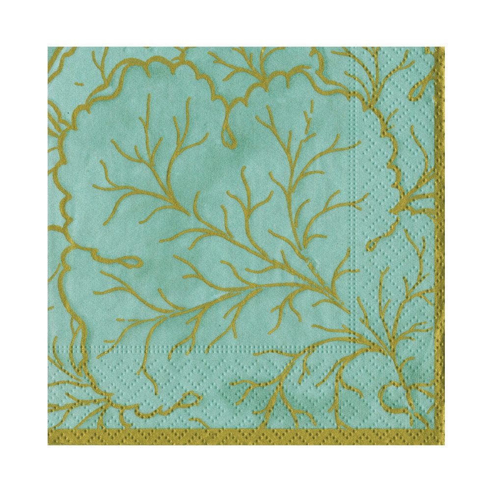 The Caspari Gilded Majolica Saltwater Collection turquoise paper napkin, featuring gold leafy branch patterns and a gold border, pairs perfectly with decorative plates for an elegant disposable table setting.