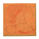 The Caspari Gilded Majolica Coral Collection square orange napkin features a textured leaf and branch pattern with a gold edge—perfect for pairing with decorative paper plates for coordinated disposable tableware.