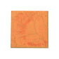 Gilded Majolica Coral Collection orange paper napkin by Caspari, featuring an embossed decorative leaf and vine pattern, offers stylish disposable tableware for any occasion. Set against a white background.