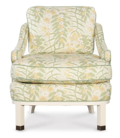 The Atchison Slipper Chair by Highland House features a light green and yellow botanical citron floral fabric, a cushioned seat and backrest, and wooden legs finished in crisp white.