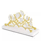The Michael Aram Butterfly Gingko Gold Vertical Napkin Holder is a handcrafted piece featuring gold and white gingko leaves on a white base, adding elegance to any collection of decorative objects.