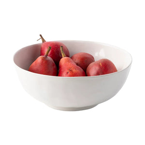 A Juliska Puro Whitewash 10" Serving Bowl holds five red pears, displayed on a plain white background.
