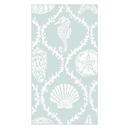 The Caspari Seychelles Aqua Napkin Collection features light blue napkins with white sea life illustrations—seahorse, starfish, sand dollar, coral, and seashells—offering a stylish and eco-friendly beach vibe.