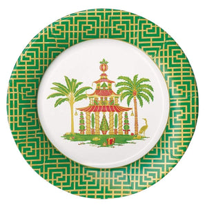 The Caspari Christmas Pagodas Collection dinner plate features a green and gold geometric border with a central pagoda, two palm trees, and a bird on a white background.