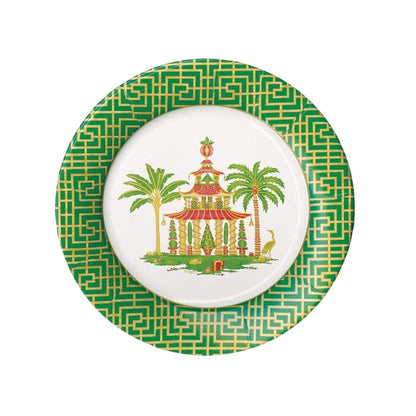 The Caspari Christmas Pagodas Collection salad plate features a green and gold geometric border and displays a central illustration of a pagoda with two palm trees.
