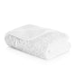 The Egoist Bath Collection towel by Graccioza features a soft, fluffy texture and high-density fabric, neatly folded on a plain white background.