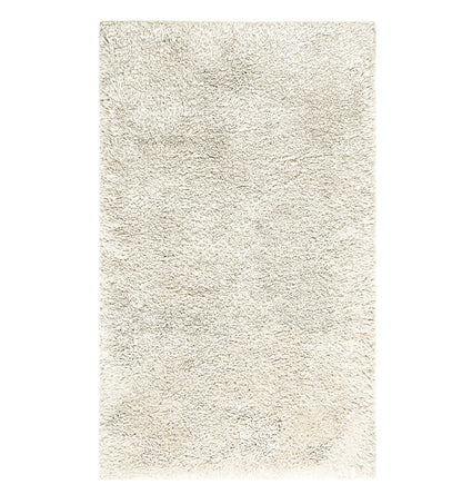 The Egoist Cloud Bath Rug Collection by Graccioza features a rectangular, light beige shaggy area rug with a soft, fluffy texture and memory foam comfort, shown from above against a white background.