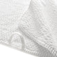Close-up of the GRACCIOZA Bee Waffle Bath Collection: a white combed cotton towel featuring stitched edges, honeycomb texture, and a fabric hanging loop.