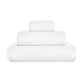 Three neatly folded white towels from the GRACCIOZA Bee Waffle Bath Collection, crafted from soft combed cotton in different sizes, are stacked atop one another against a plain white background.