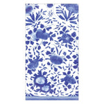 The Caspari Delft Blue Napkin Collection features a dense blue and white floral pattern with various flowers and leaves on eco-friendly, triple-ply napkins with a crisp white background.