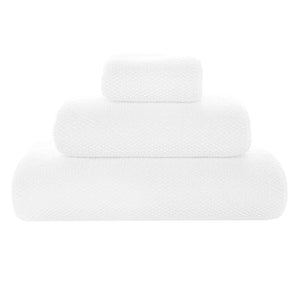 Three ultra-soft, white bath towels from the Graccioza Pearls Bath Collection are elegantly stacked from largest to smallest on a plain background.