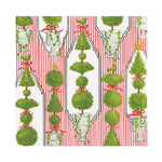 The Eloise Napkin and Placemat Collection by Caspari features green topiary trees with red bows and gold stars on a red and white striped background. Triple-ply napkins are printed in Germany on chlorine-free materials.