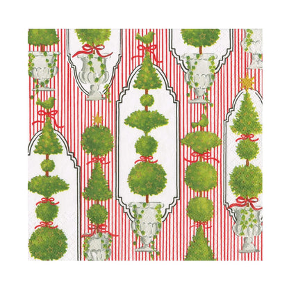 The Eloise Napkin and Placemat Collection by Caspari features green topiary trees with red bows and gold stars on a red and white striped background. Triple-ply napkins are printed in Germany on chlorine-free materials.