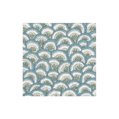 The Pontchartrain Scallop Collection by Caspari features eco-friendly, triple-ply napkins with a dense scalloped pattern of overlapping fan-shaped leaves in blue, green, and white.