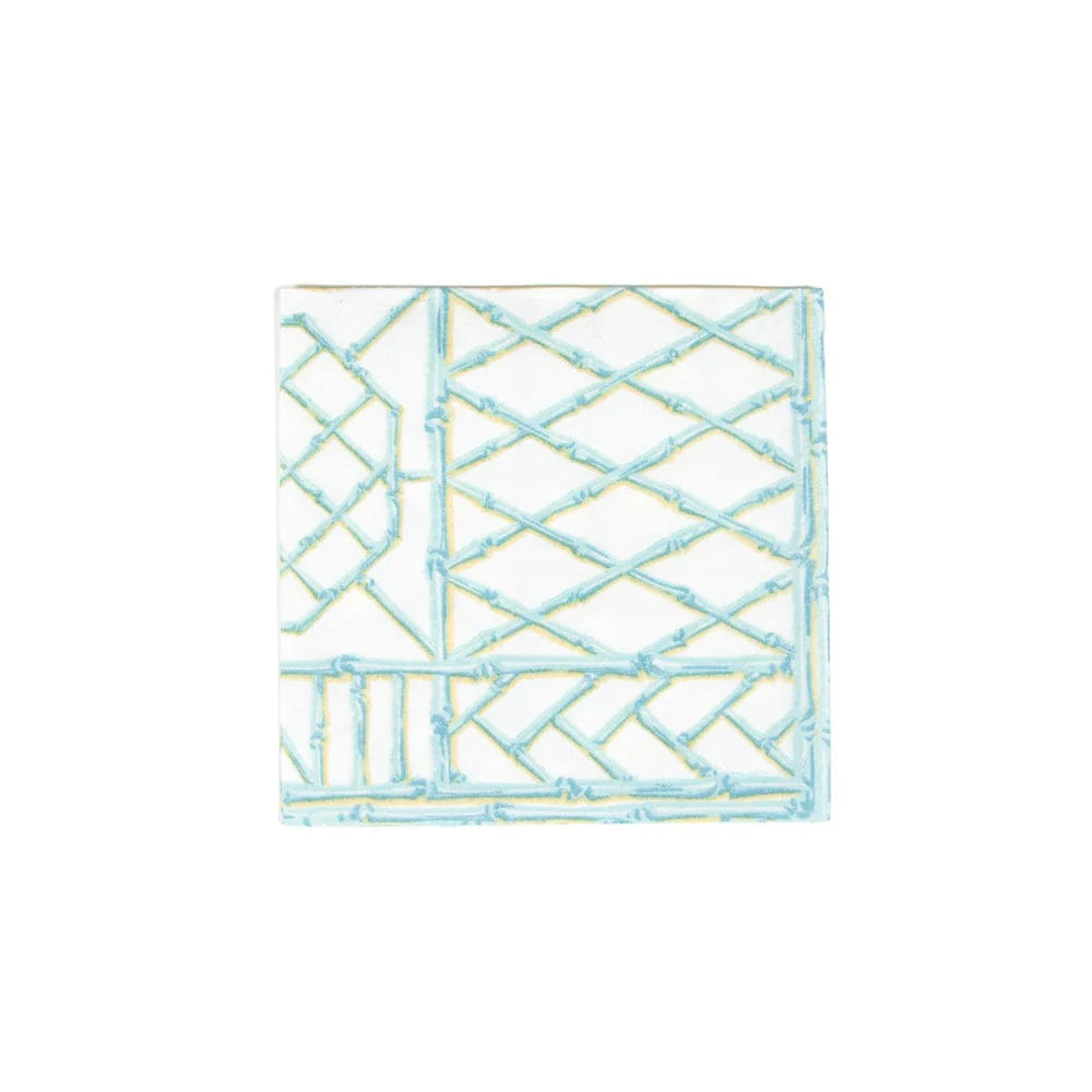 The Bamboo Screen Collection by Caspari features square white tiles with raised geometric patterns in light blue and yellow—an eco-friendly design inspired by biodegradable materials.