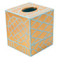 The Caspari Bamboo Screen Robin's Egg Bath Collection features a handcrafted square tissue box cover from Vietnam, with a gold base and light blue geometric lacquerware patterns and a circular top opening.