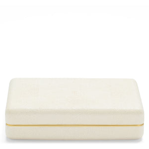 The Aerin Shagreen Card Set in cream features a closed rectangular box with embossed shagreen texture, gold trim, and a luxe suede interior.