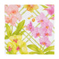 The Orchid Conservatory Collection by Caspari features pink, yellow, and purple orchids with green leaves on a white lattice background—ideal for elegant table settings or stylish party supplies.