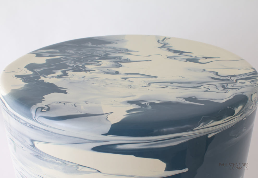 Part of the Paul Schneider Ceramics Cylindrical Garden Stool Collection, this glossy ceramic stool features a blue and white marbled finish, with subtle variations that ensure each piece is unique.