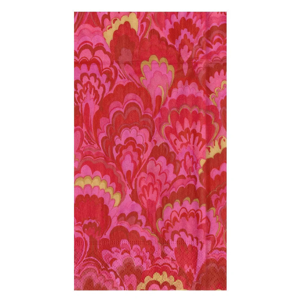 A Caspari fabric from the Marbled Ceramica Collection, showcasing a scallop-inspired pattern in pink, red, and yellow hues reminiscent of marbled waves.