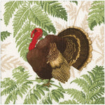 Featuring Caspari's Turkey Among Ferns Partyware Collection: a turkey with brown and gold feathers among green ferns on white—ideal for autumn table settings.