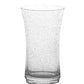 A clear, empty tumbler from the Juliska Provence Basil Drinkware Collection, featuring a slightly flared rim and textured surface, is shown against a white background.