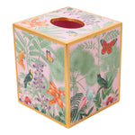 The Caspari Paradise Garden Bath Collection features a pink square tissue box cover, handcrafted in Vietnam with gold edges and lacquerware details of tropical plants, birds, and butterflies.
