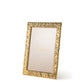 A gold, textured Ambroise Frame from Aerin stands upright on a white background, showcasing a placeholder insert labeled "AERIN" in gold text.
