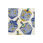 Add a touch of festive celebration to your Hanukkah gifts with the Patterned Dreidel Collection from Caspari—blue and gold dreidels adorned with Hebrew letters on a white background featuring elegant gold swirls, perfect for the holiday season.