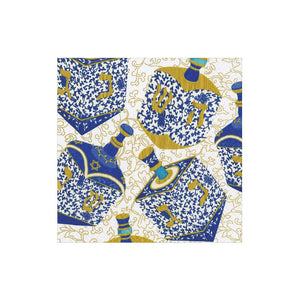 Add a touch of festive celebration to your Hanukkah gifts with the Patterned Dreidel Collection from Caspari—blue and gold dreidels adorned with Hebrew letters on a white background featuring elegant gold swirls, perfect for the holiday season.
